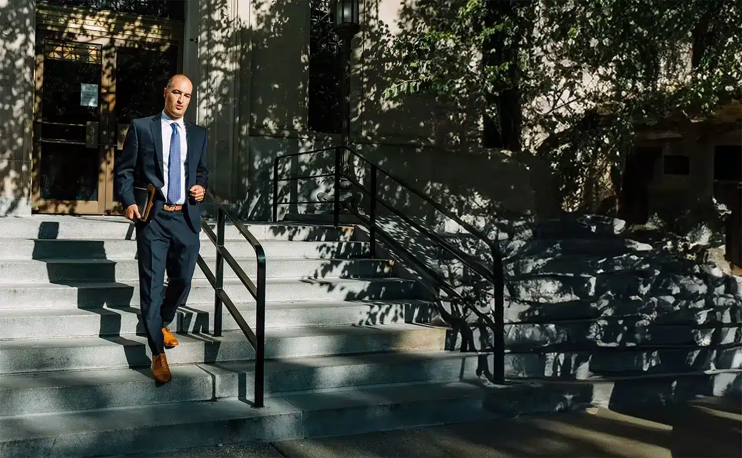 Attorney Mashni at Mashni law walking down courtroom steps